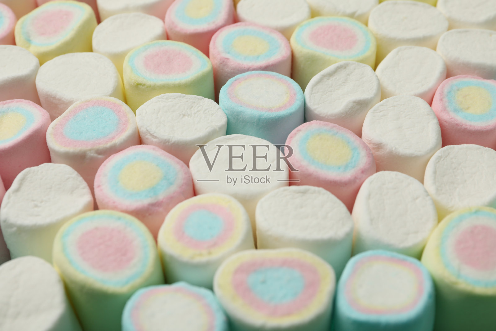 背景是香甜的棉花糖，特写照片摄影图片