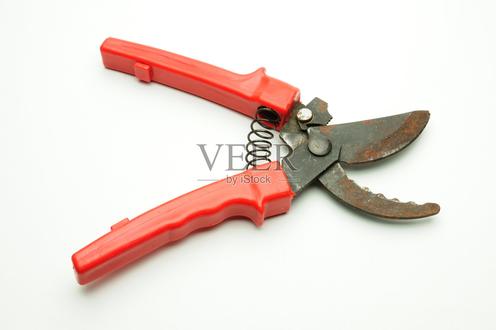 在白色背景上修剪树枝和灌木的剪刀照片摄影图片