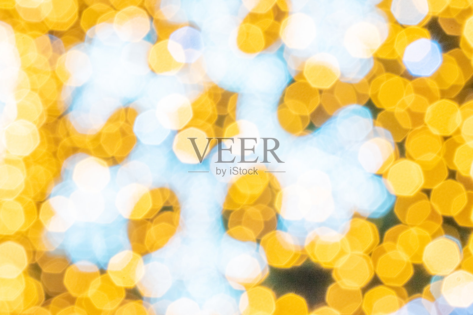 金黑色抽象光散景。节日闪光模糊背景。圣诞和新年假日背景。照片摄影图片