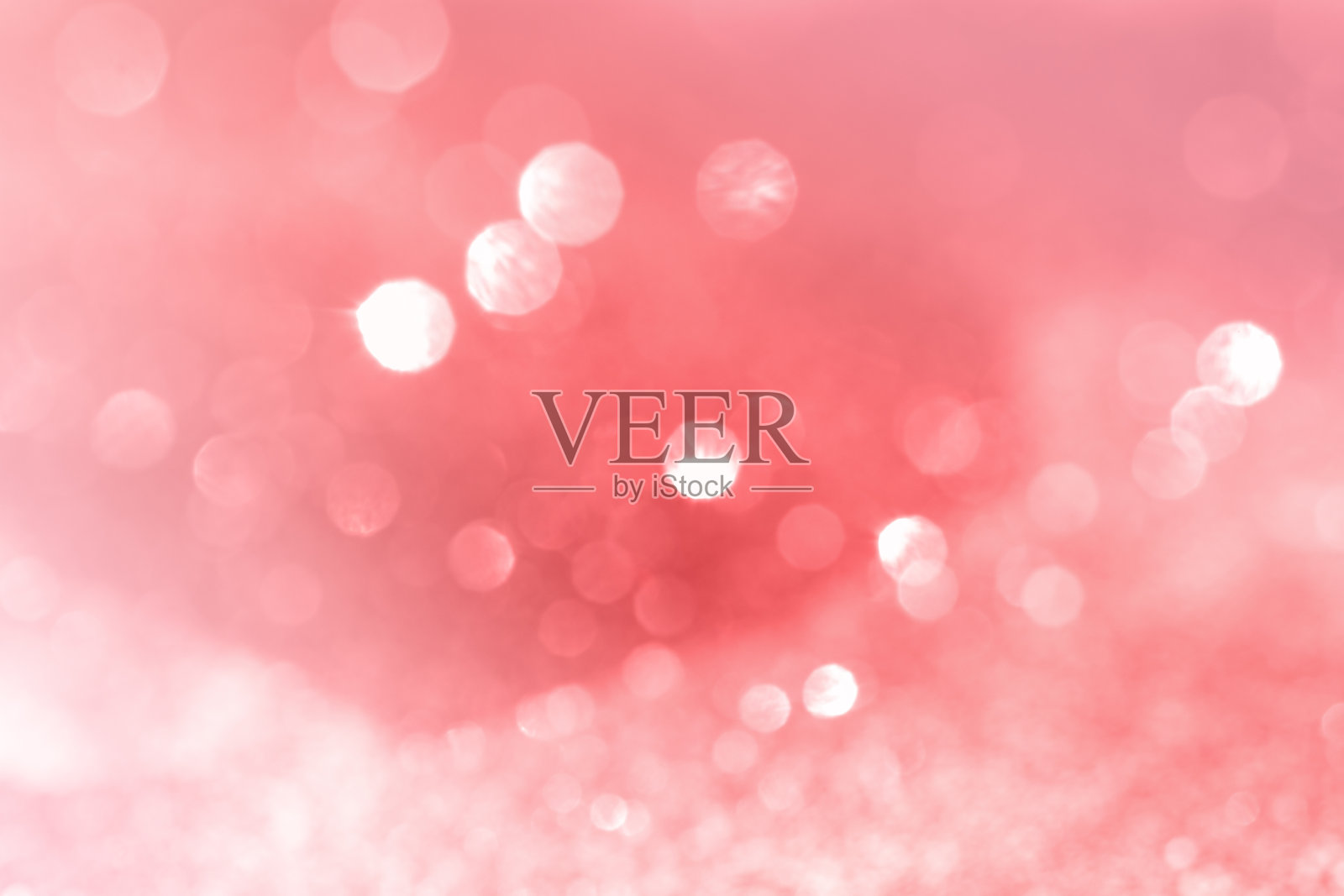 模糊的粉色背景与抽象的散景灯与柔和的灯光背景。照片摄影图片