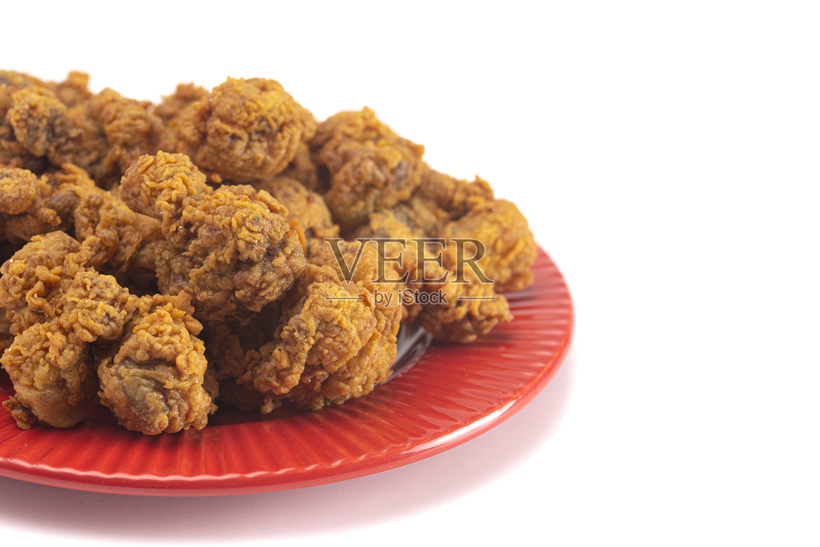 油炸和酥脆鸡肫孤立在一个白色的背景照片摄影图片