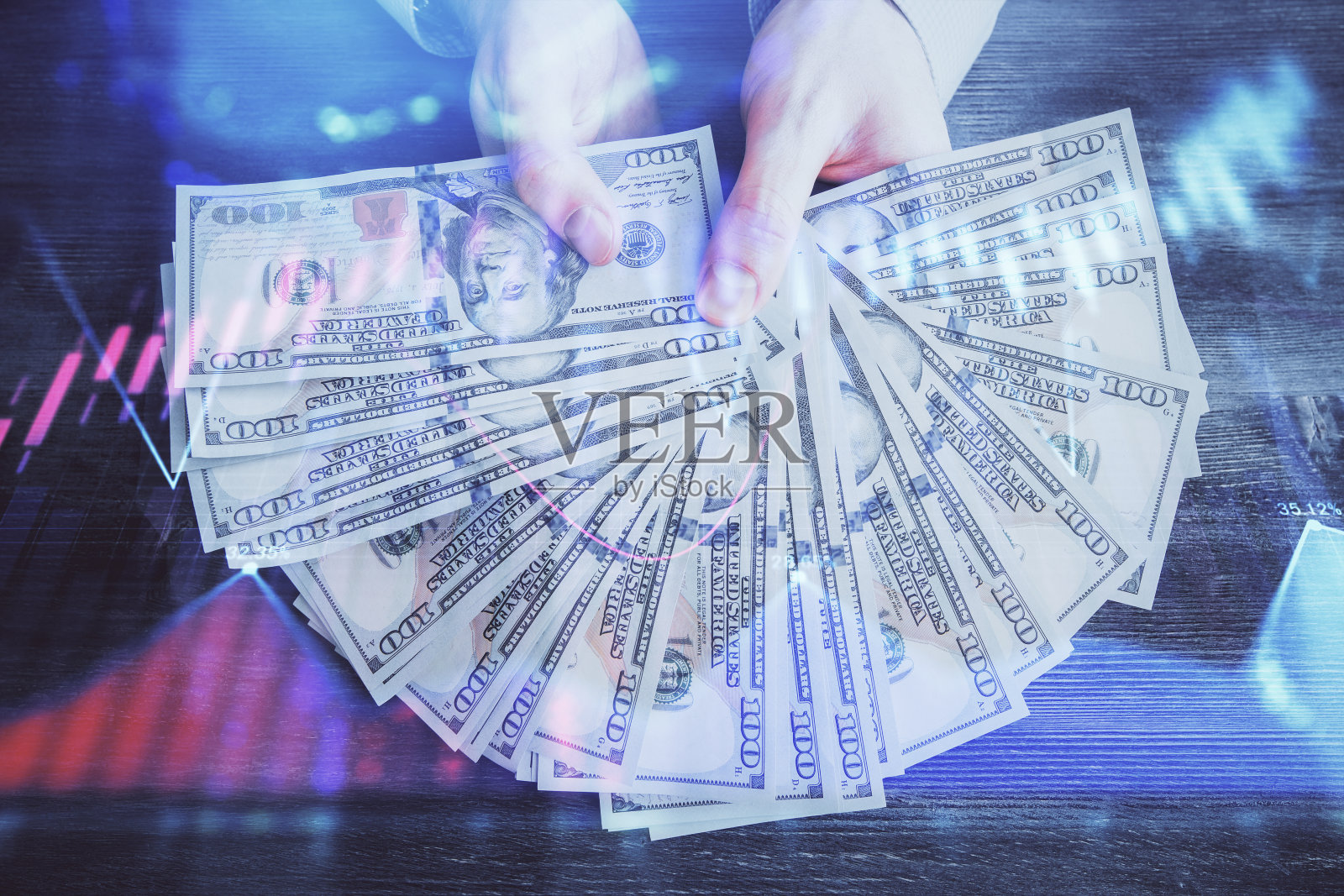 多次曝光金融图形绘图全息图和美元钞票和人的手。分析的概念。照片摄影图片