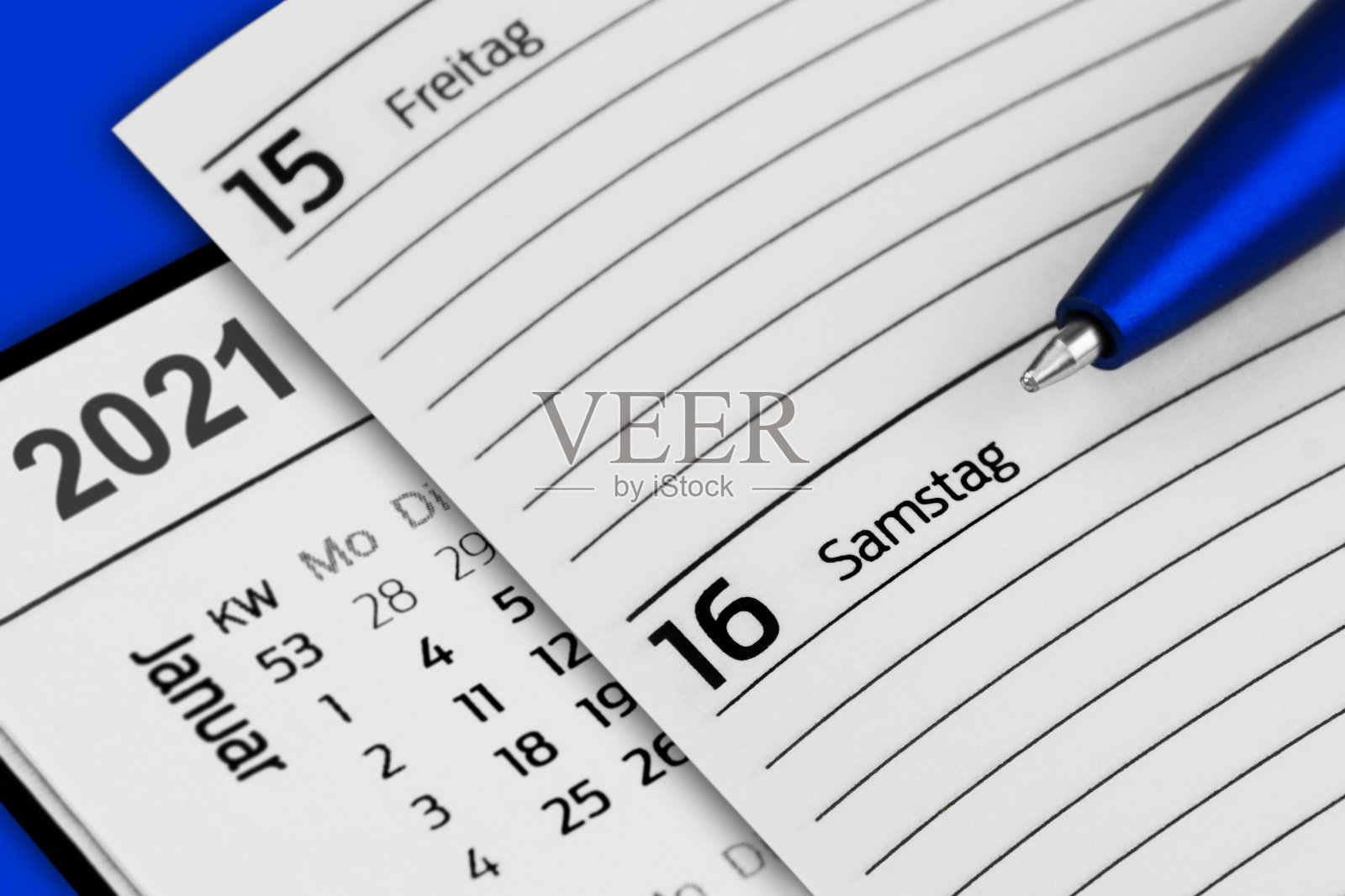 2021年1月16日日历和蓝色背景照片摄影图片