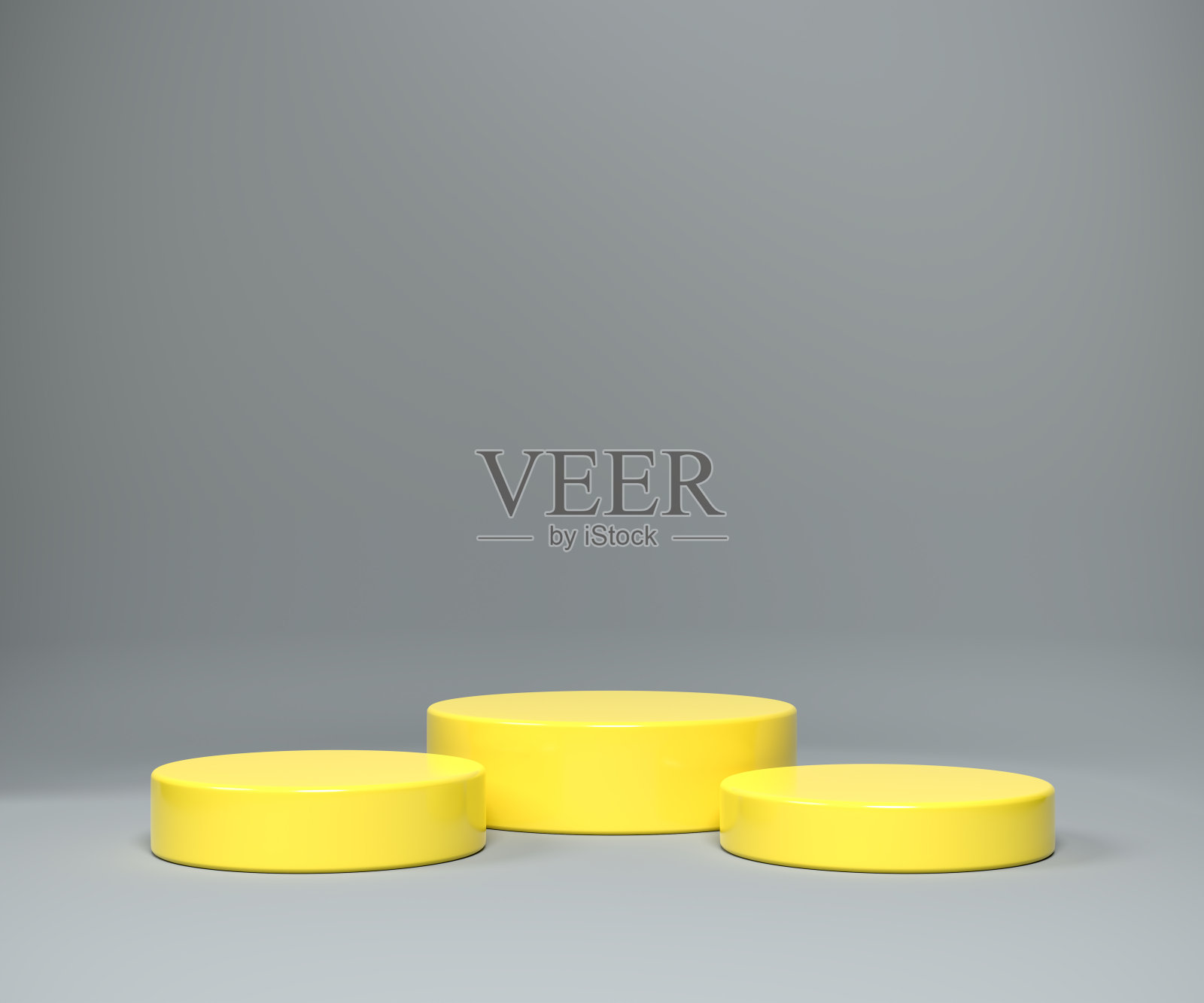 三个不同大小的底座在2021年的颜色照明黄色在最终的灰色无缝背景。照片摄影图片