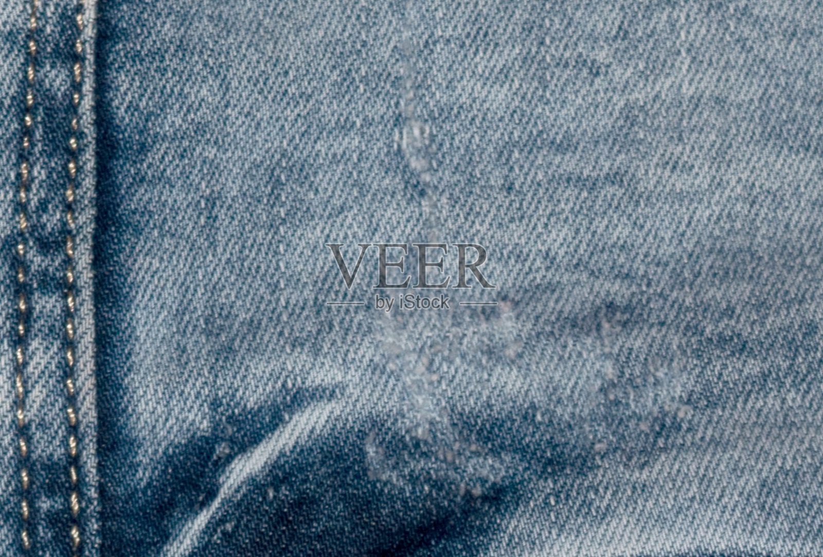 背景牛仔裤上的布料针脚很紧照片摄影图片