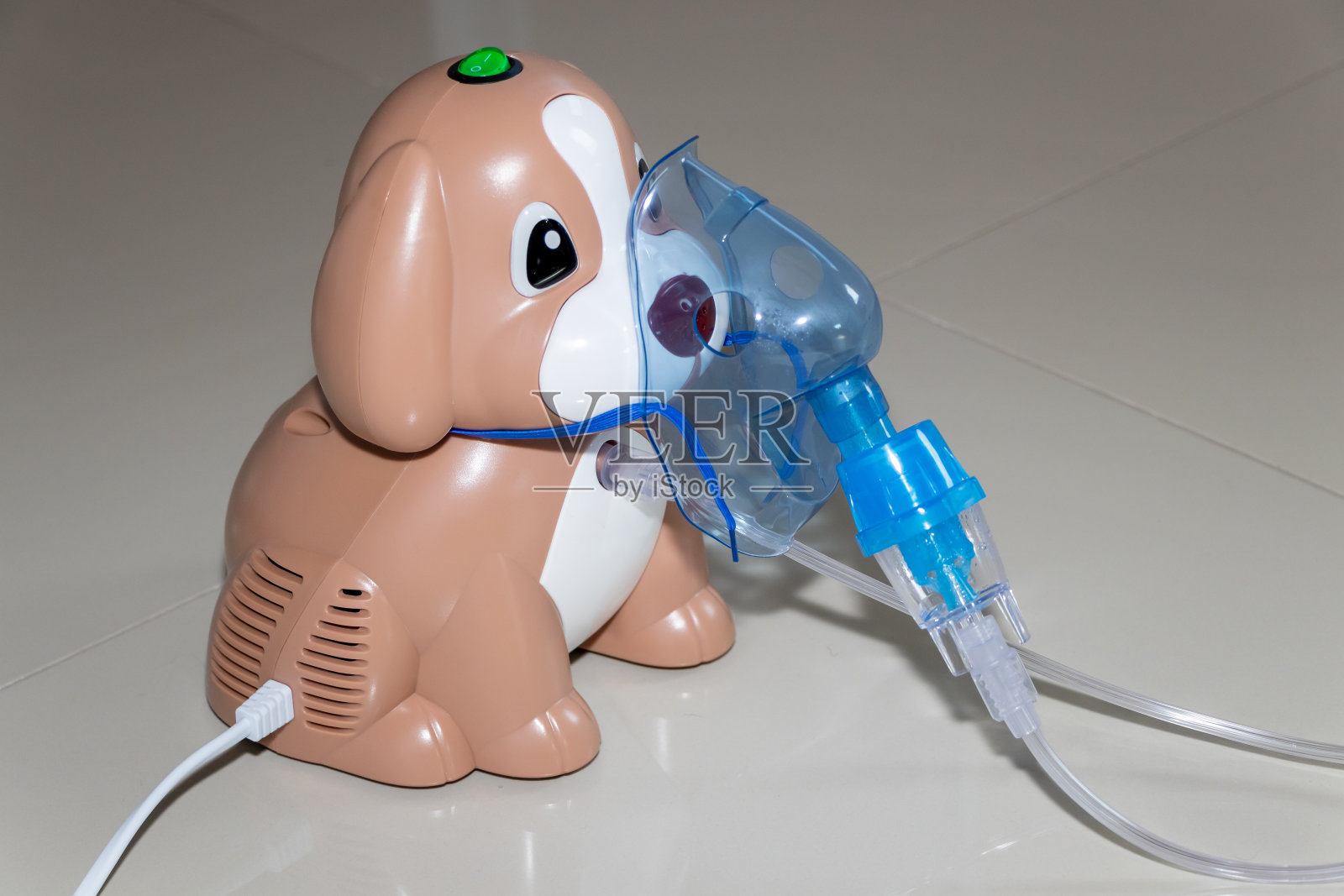 一个宠物狗形状的吸入器照片摄影图片