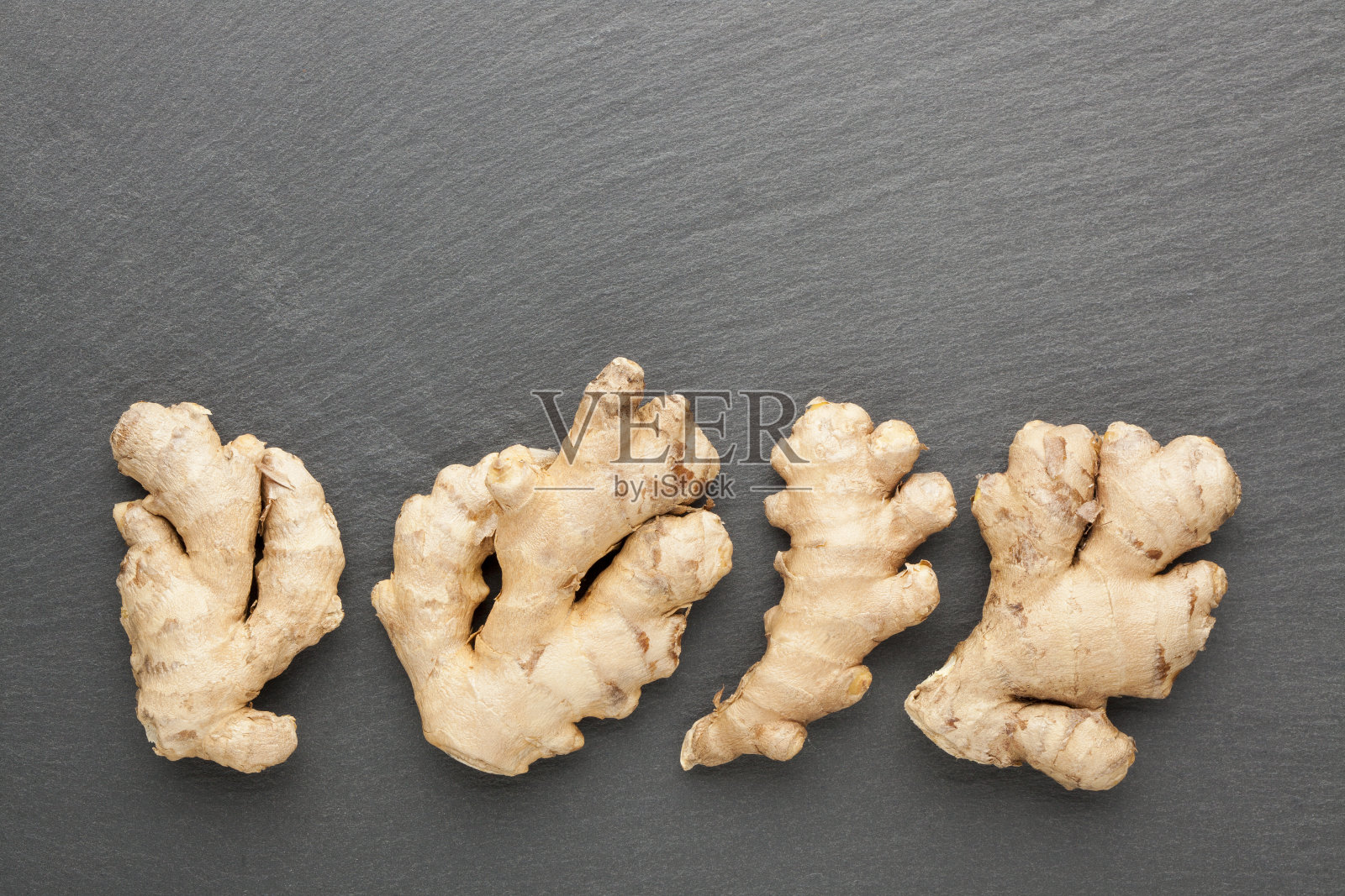 石头上的姜照片摄影图片