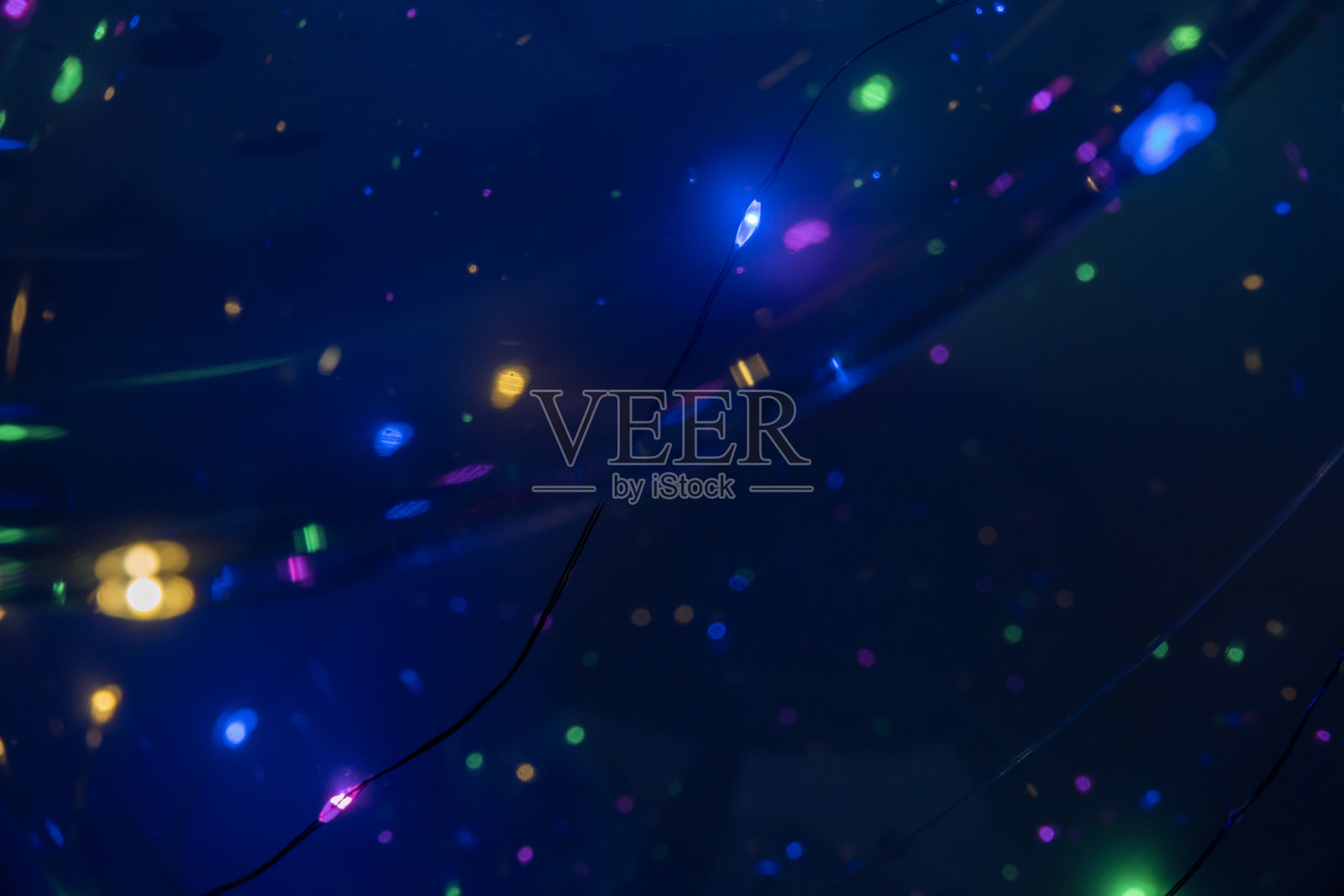 蓝色节日圣诞优雅抽象背景与散景灯和星星照片摄影图片