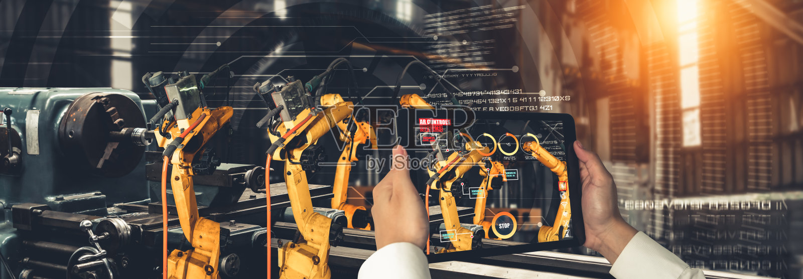工程师通过增强现实工业技术控制机械臂照片摄影图片