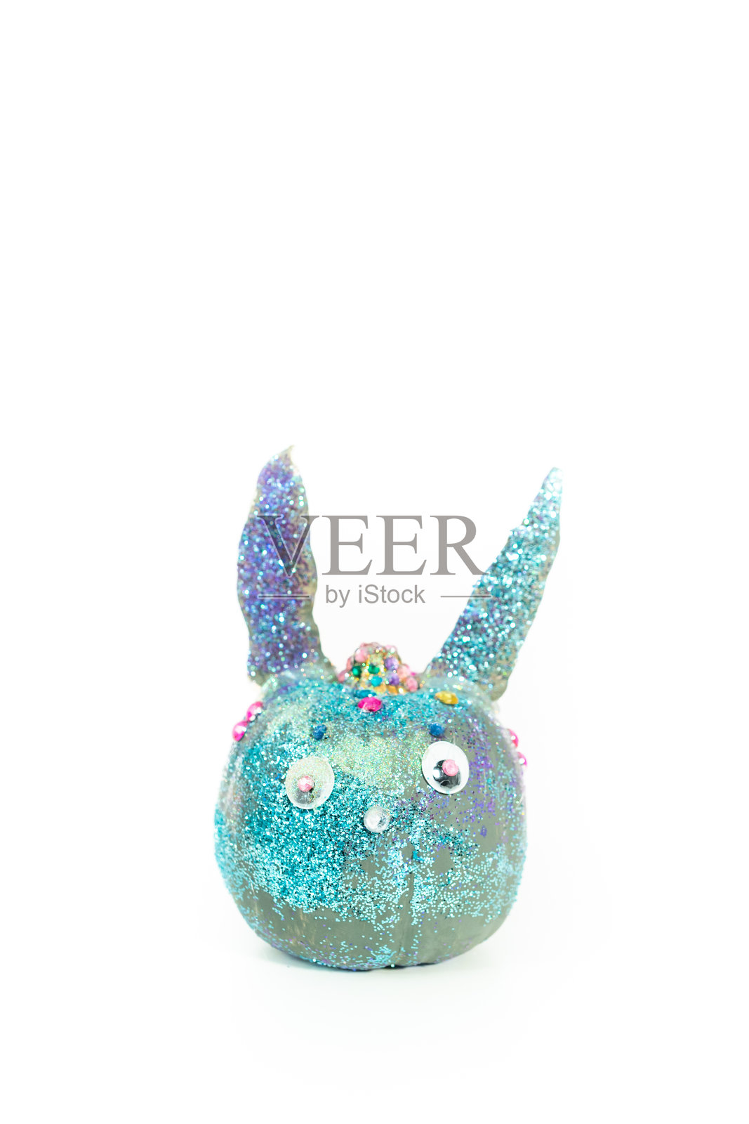 万圣节的南瓜工艺品装饰成兔子的耳朵和闪闪发光的照片摄影图片