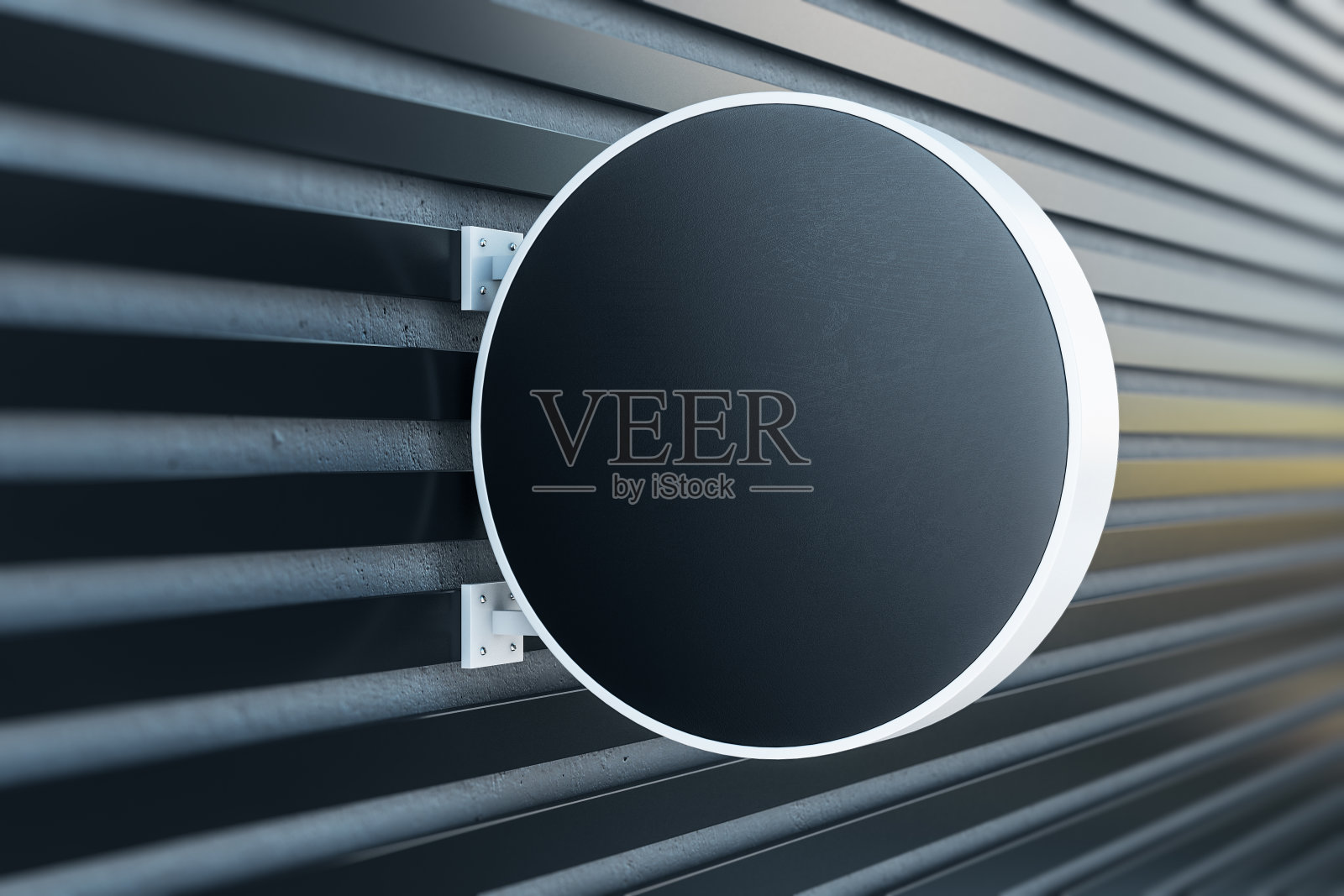 墙上的黑色圆形招牌。照片摄影图片