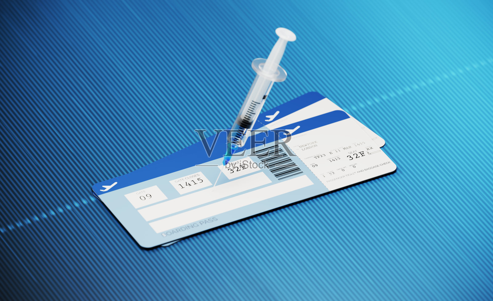 COVID-19免疫护照和旅行概念-登机牌配对钉注射器在蓝色背景照片摄影图片