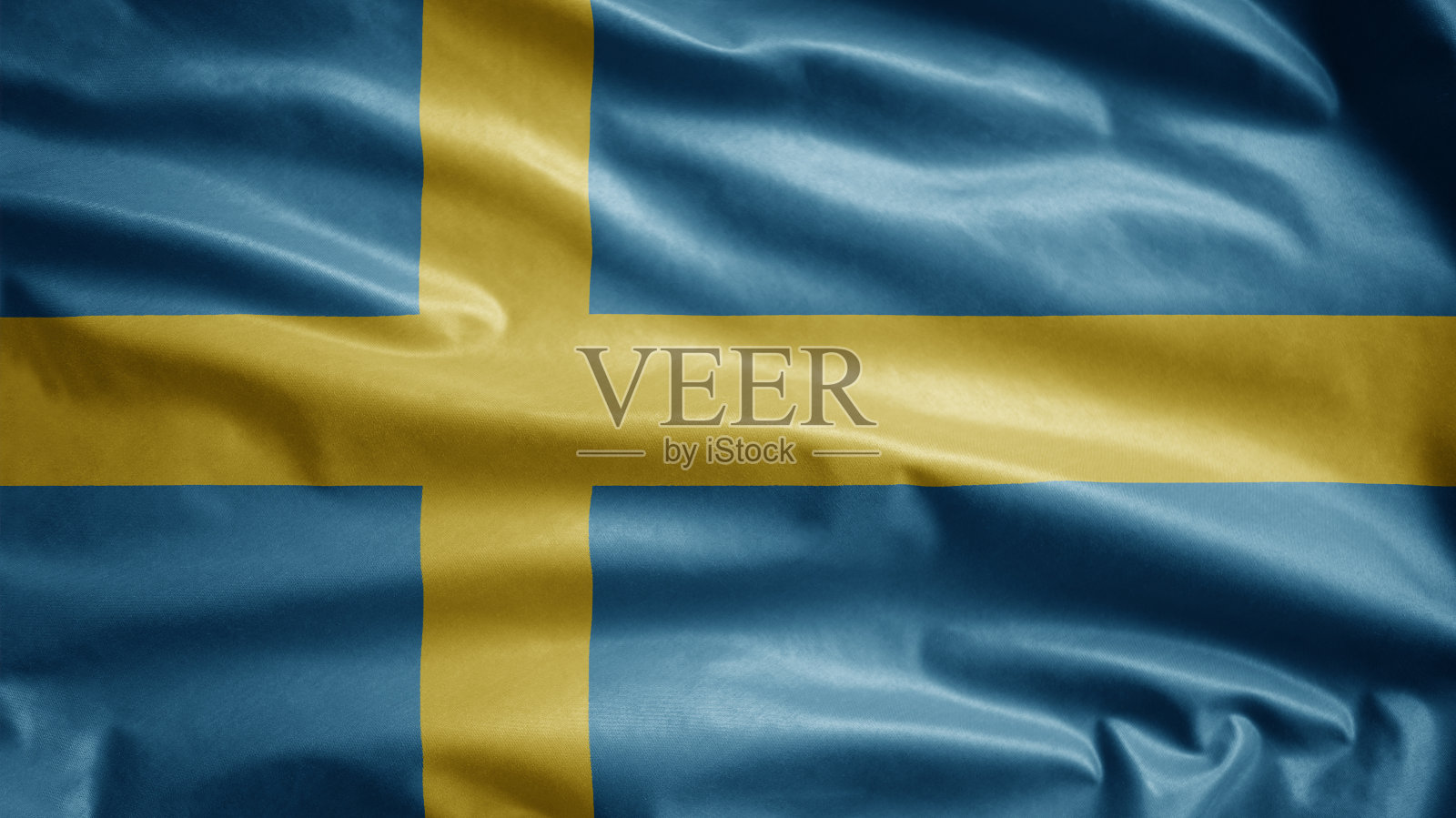 瑞典国旗在风中飘扬。特写瑞典的旗帜飘扬，丝质柔软。照片摄影图片