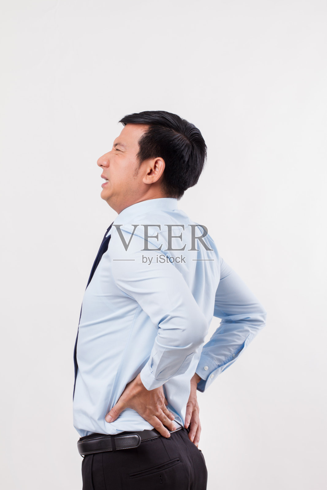 商人遭受背部疼痛，脊椎受伤照片摄影图片