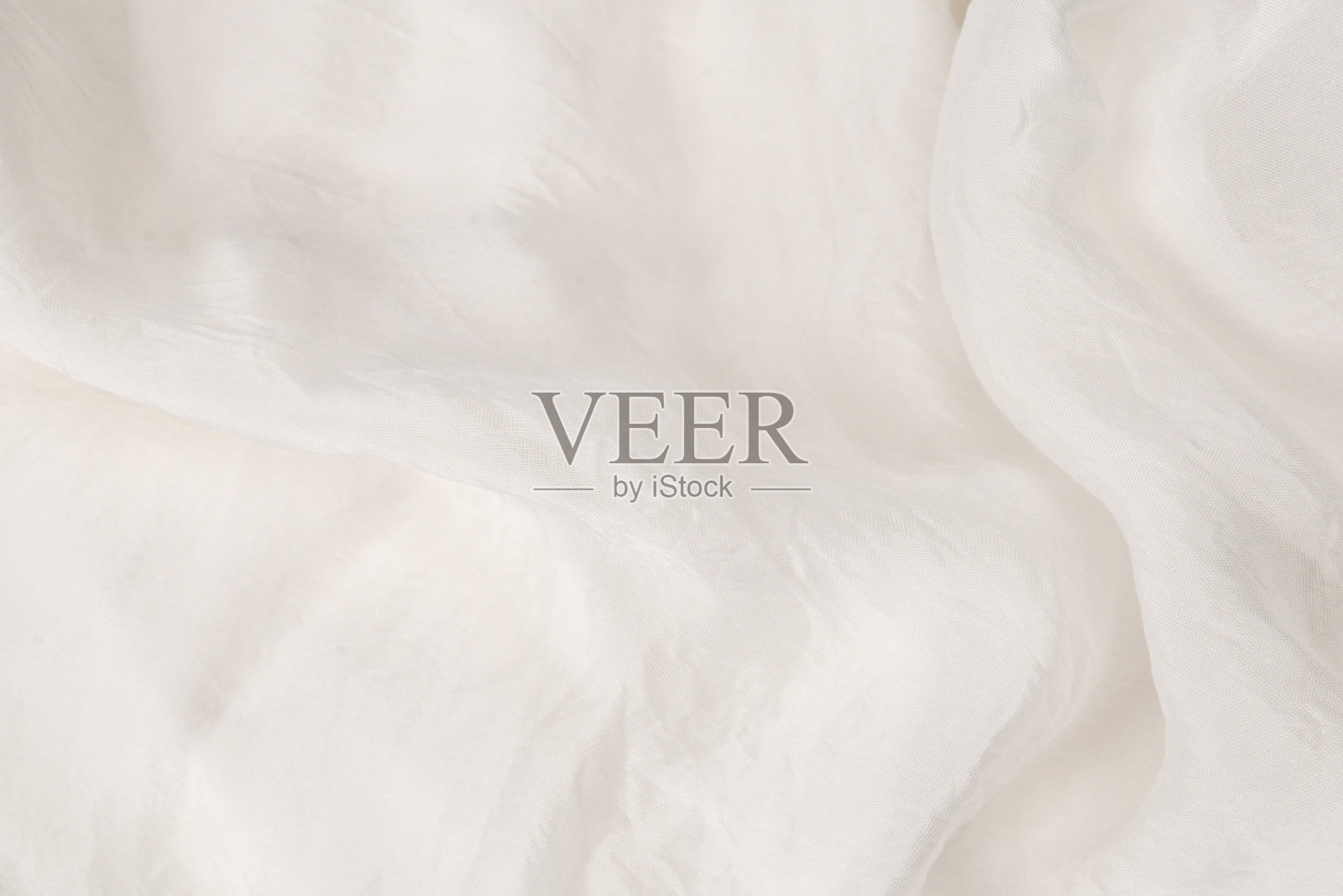 柔软光滑的白色丝绸面料背景。面料质地。照片摄影图片