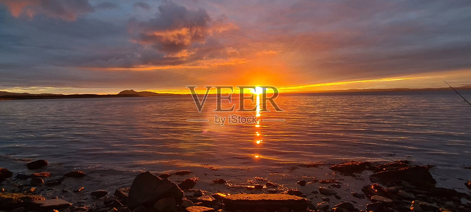 日落海滩上照片摄影图片