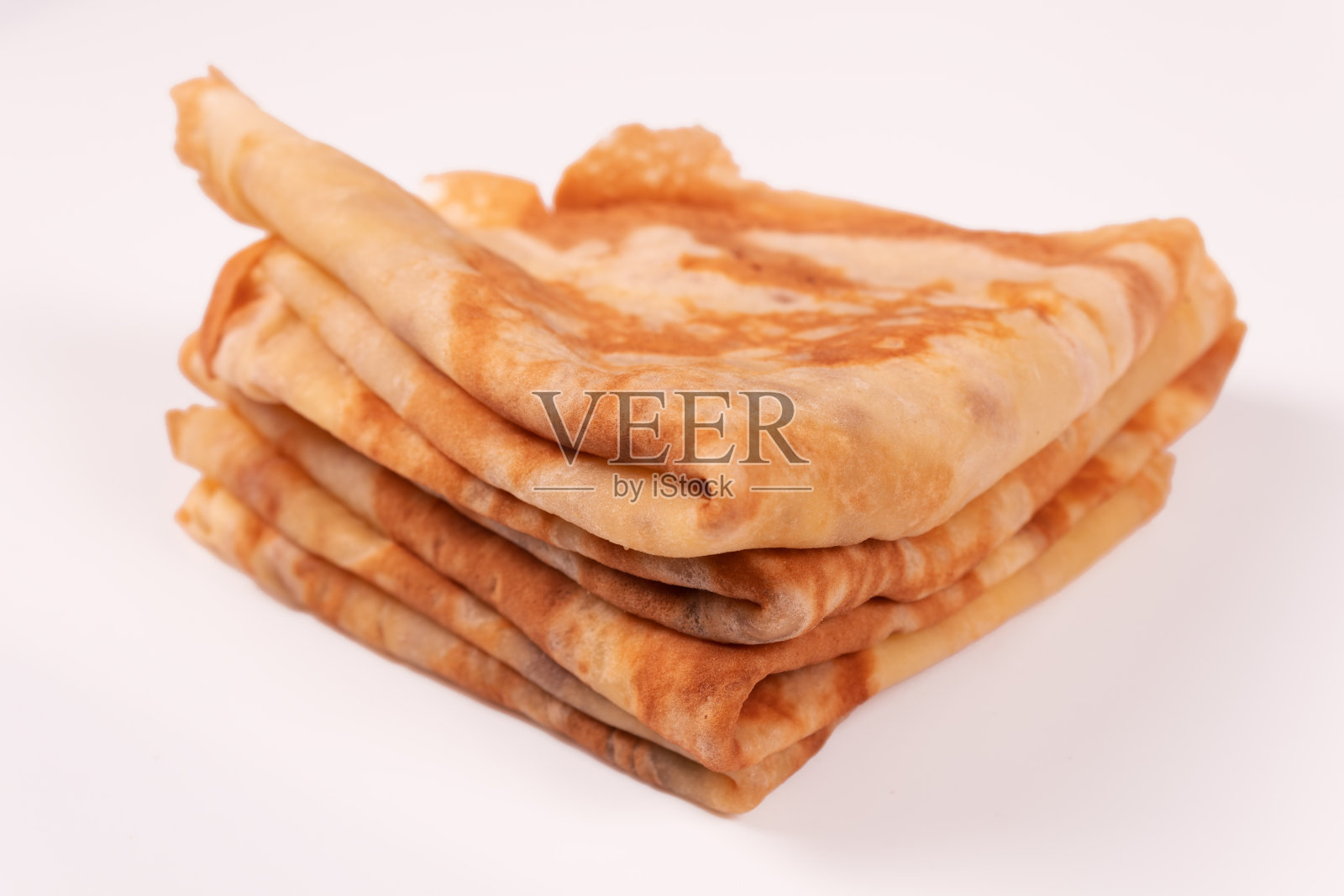 一叠叠成三角形的煎饼照片摄影图片