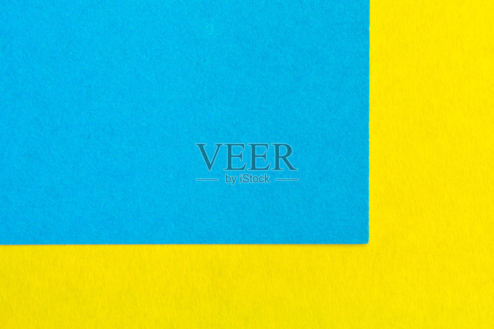 黄色和蓝色的纸纹理背景颜色。趋势颜色，几何背景的纸张。彩色软纸背景。柔和的颜色。照片摄影图片