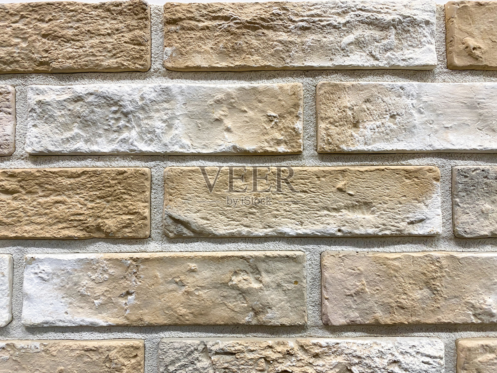 灰色和棕色的砖石背景，立墙图案纹理。砖砌的。由砖块制成的建筑细节照片摄影图片