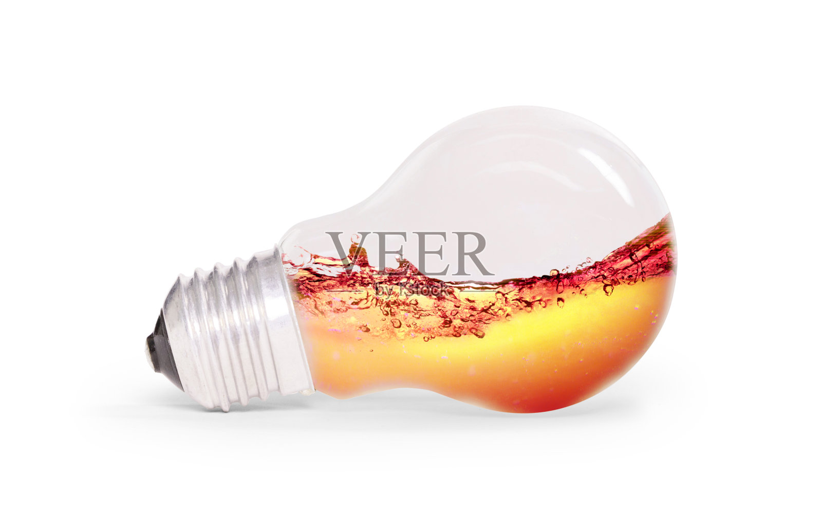 灯泡里面有橙色的水，孤立在白色上照片摄影图片