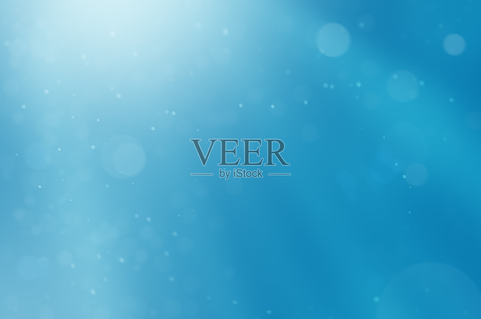 粒子在一个模糊的蓝色背景照片摄影图片