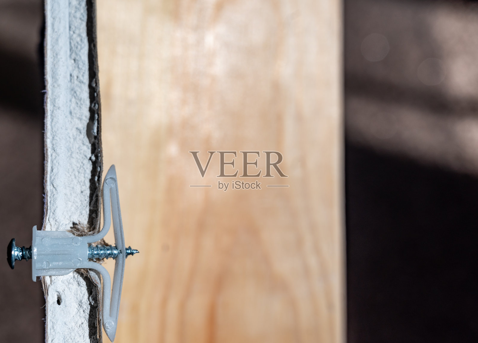 选择性地关注干墙锚孔视图照片摄影图片