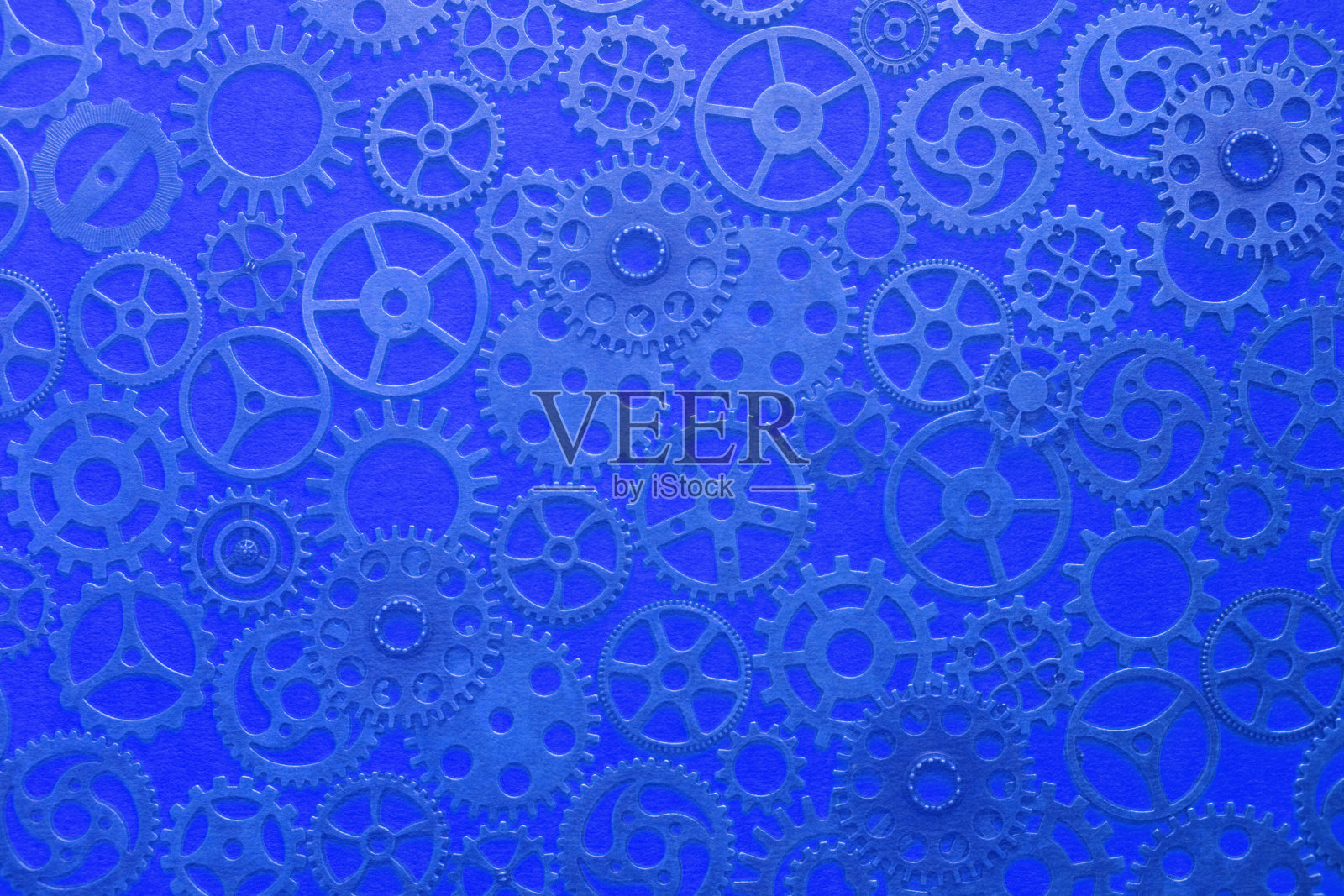 齿轮，抽象的背景，许多带有蓝色色调的小齿轮，蒸汽朋克。照片摄影图片