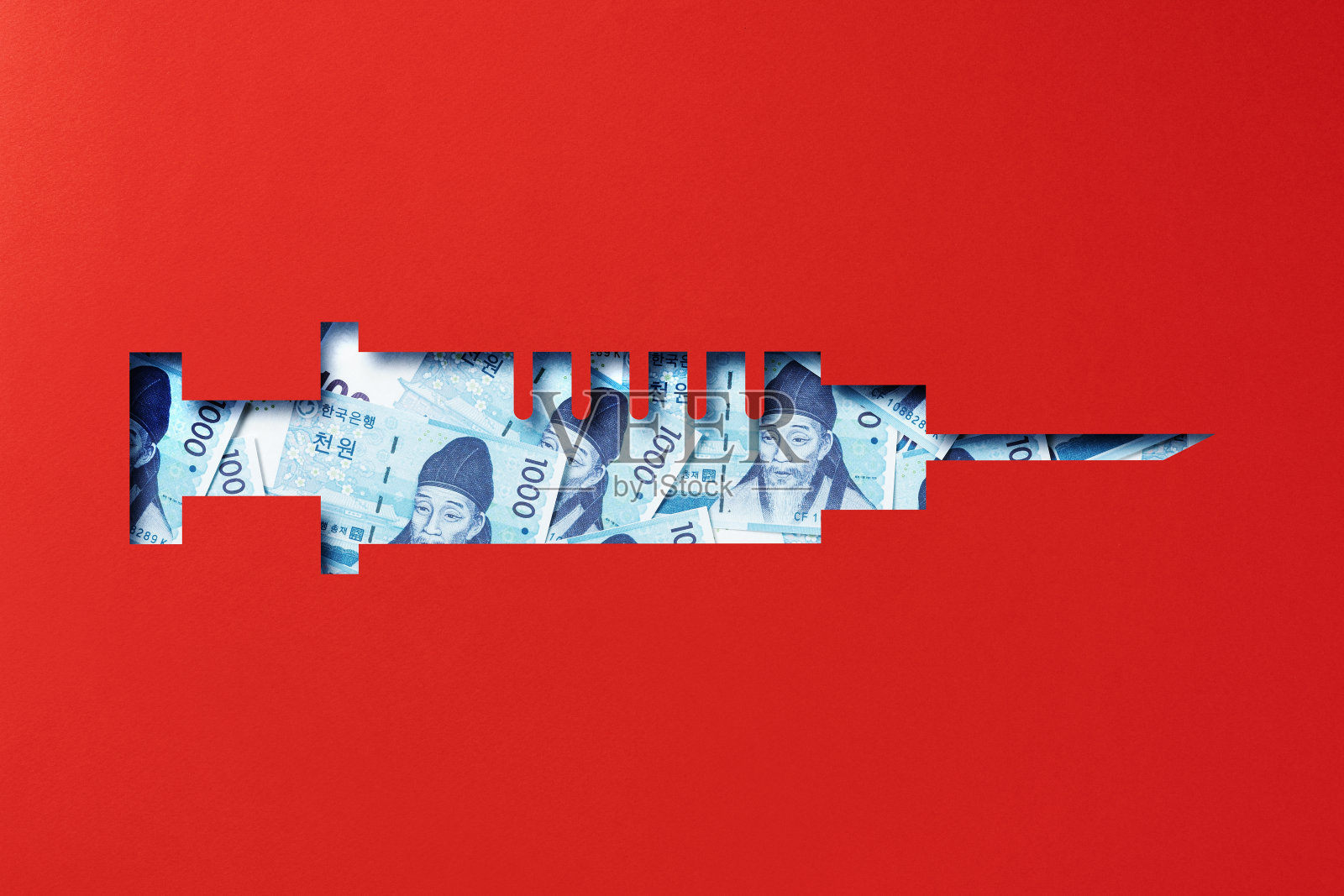 韩圆堆在纸下剪出疫苗图标照片摄影图片