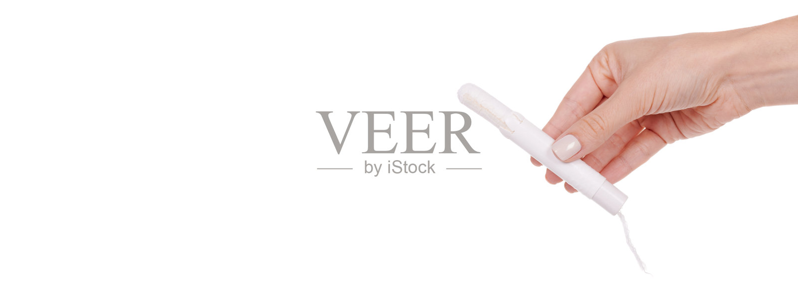 手用女性棉条，月经周期。孤立在白色背景上。照片摄影图片