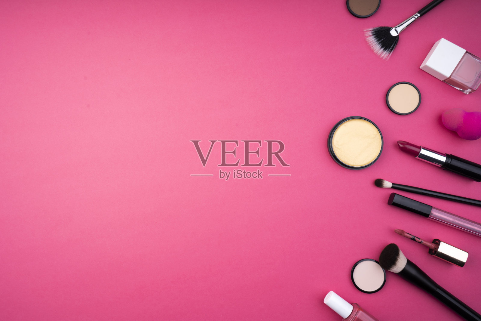 在粉红色的背景上化妆照片摄影图片