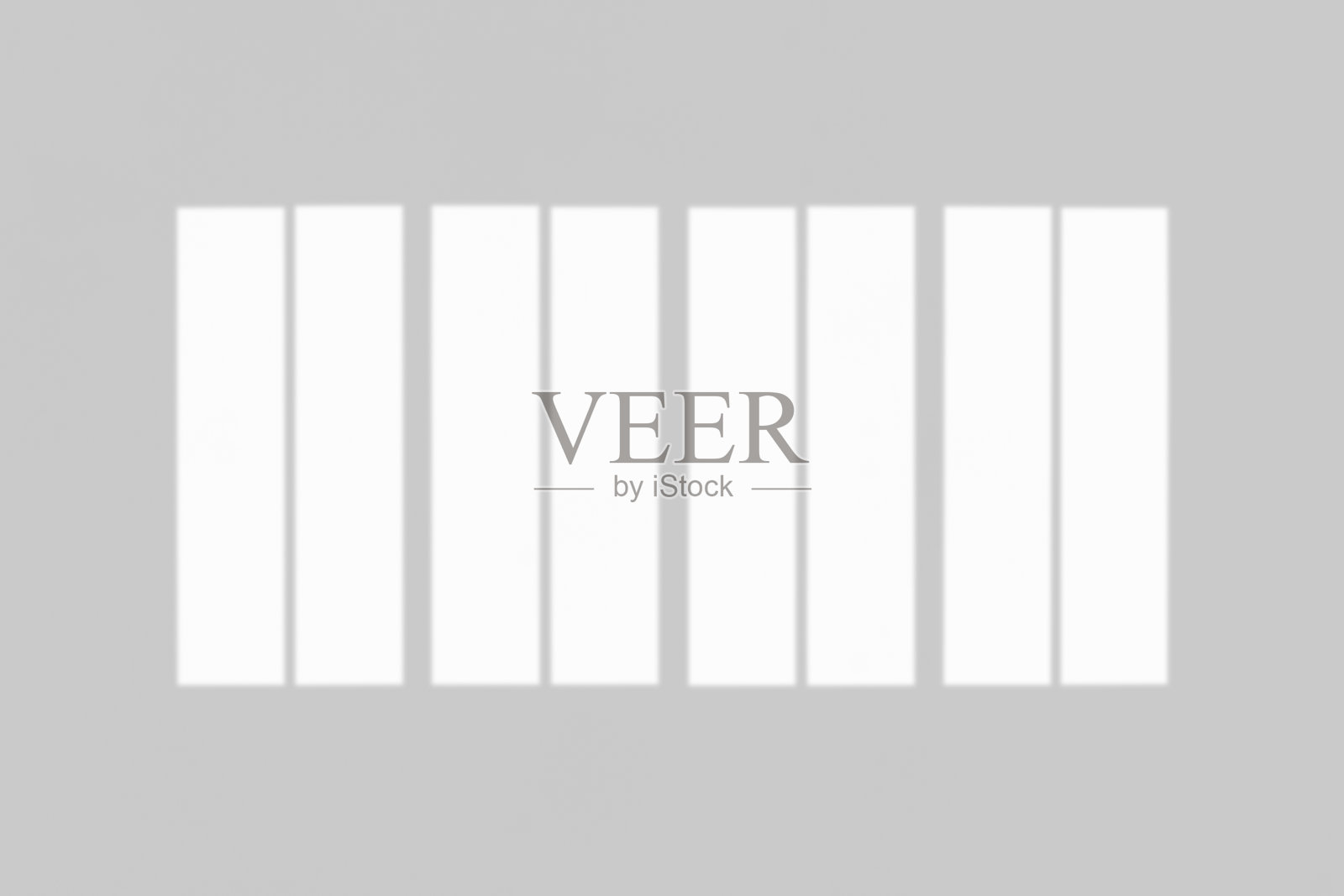 窗户的阴影落在白色的墙壁背景上照片摄影图片