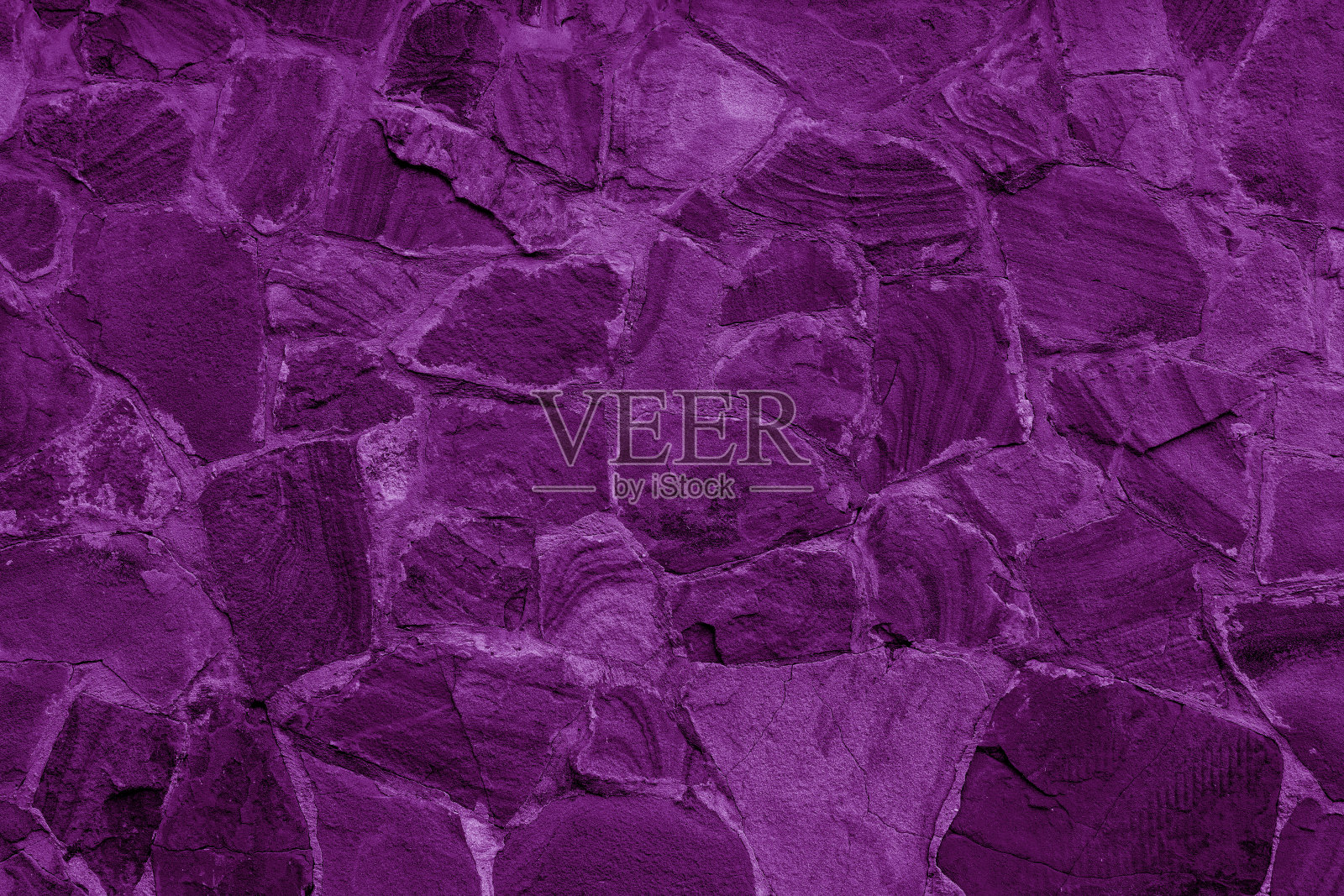 粉红色的石头建筑墙。照片摄影图片