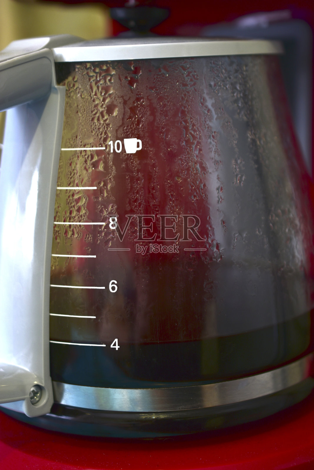 咖啡机中用来装饮料的玻璃容器照片摄影图片