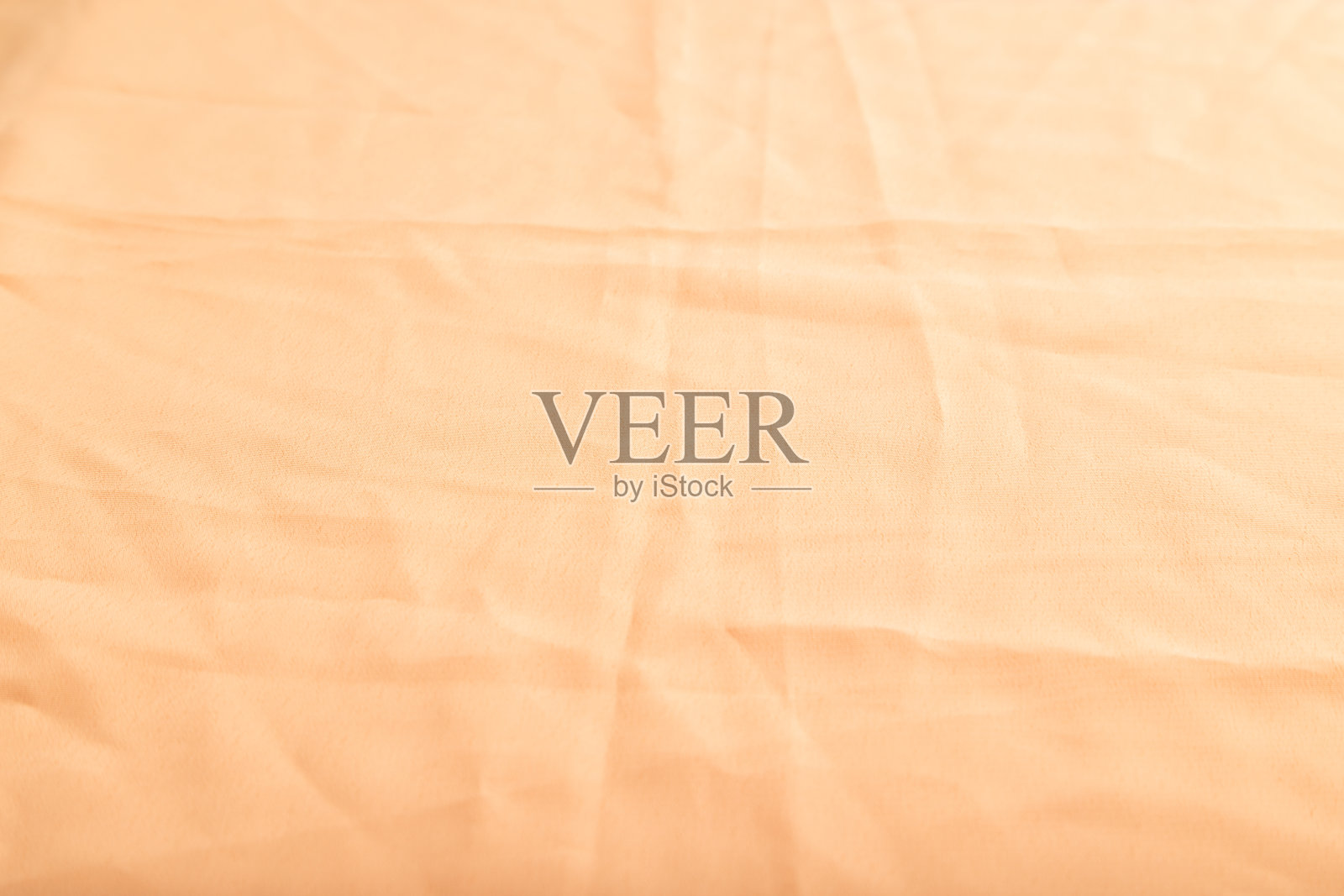 光滑的橙色亚麻织物碎片。侧视图，天然纺织品背景和纹理。照片摄影图片