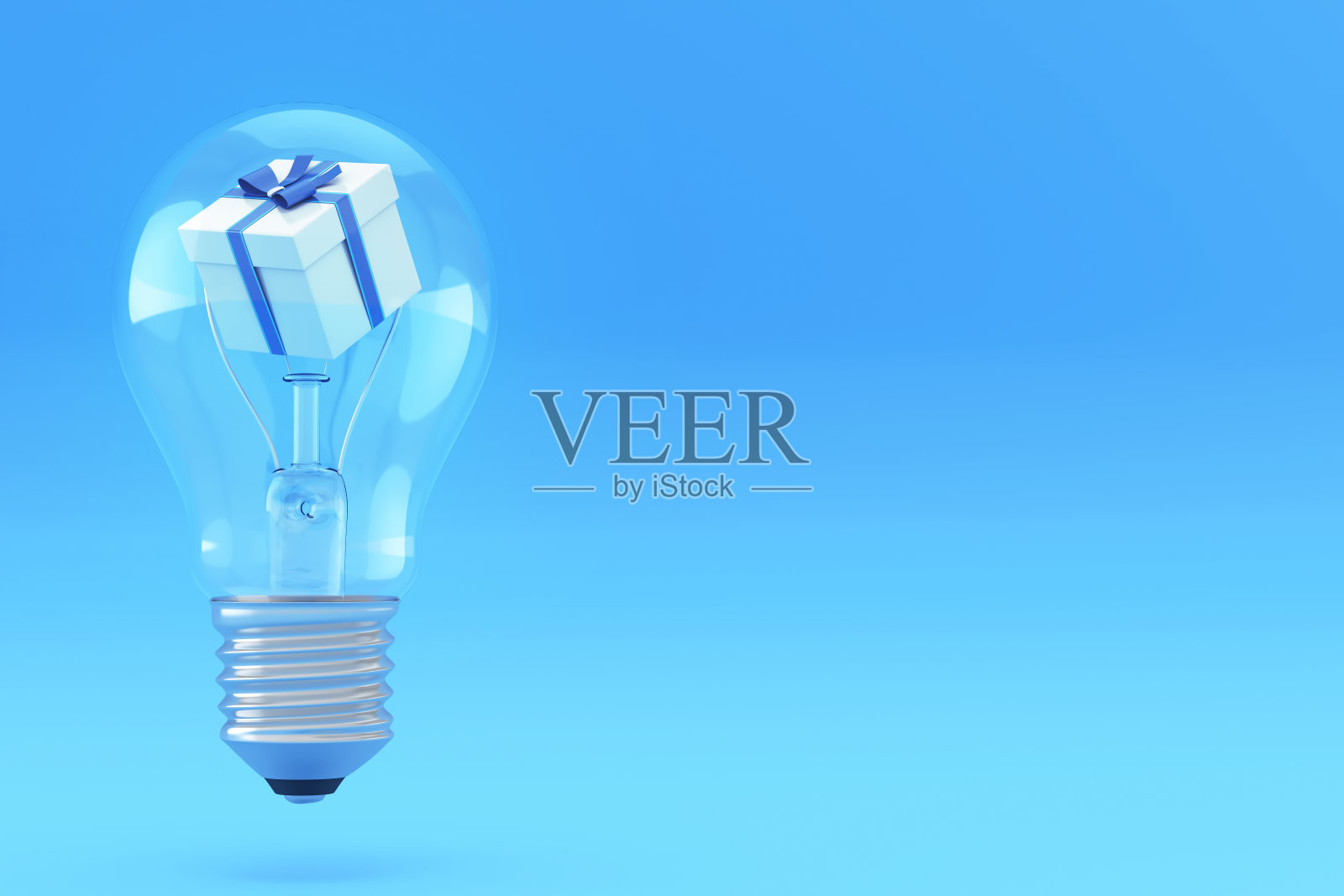 礼盒内灯泡上的渐变蓝色库存照片照片摄影图片