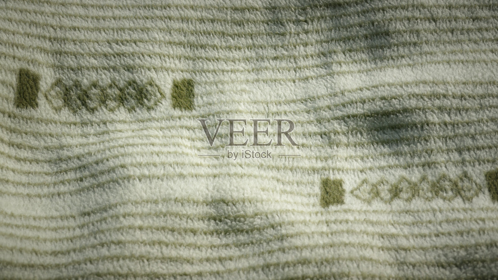 带有几何图案的绿色羊毛毯子照片摄影图片