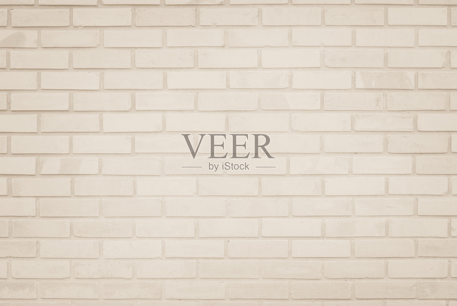 空背景宽奶油色砖墙纹理。旧棕色砖墙混凝土或石材自然图案，壁纸石灰石抽象地板/网格不平的室内岩石。家庭和办公室设计背景。照片摄影图片