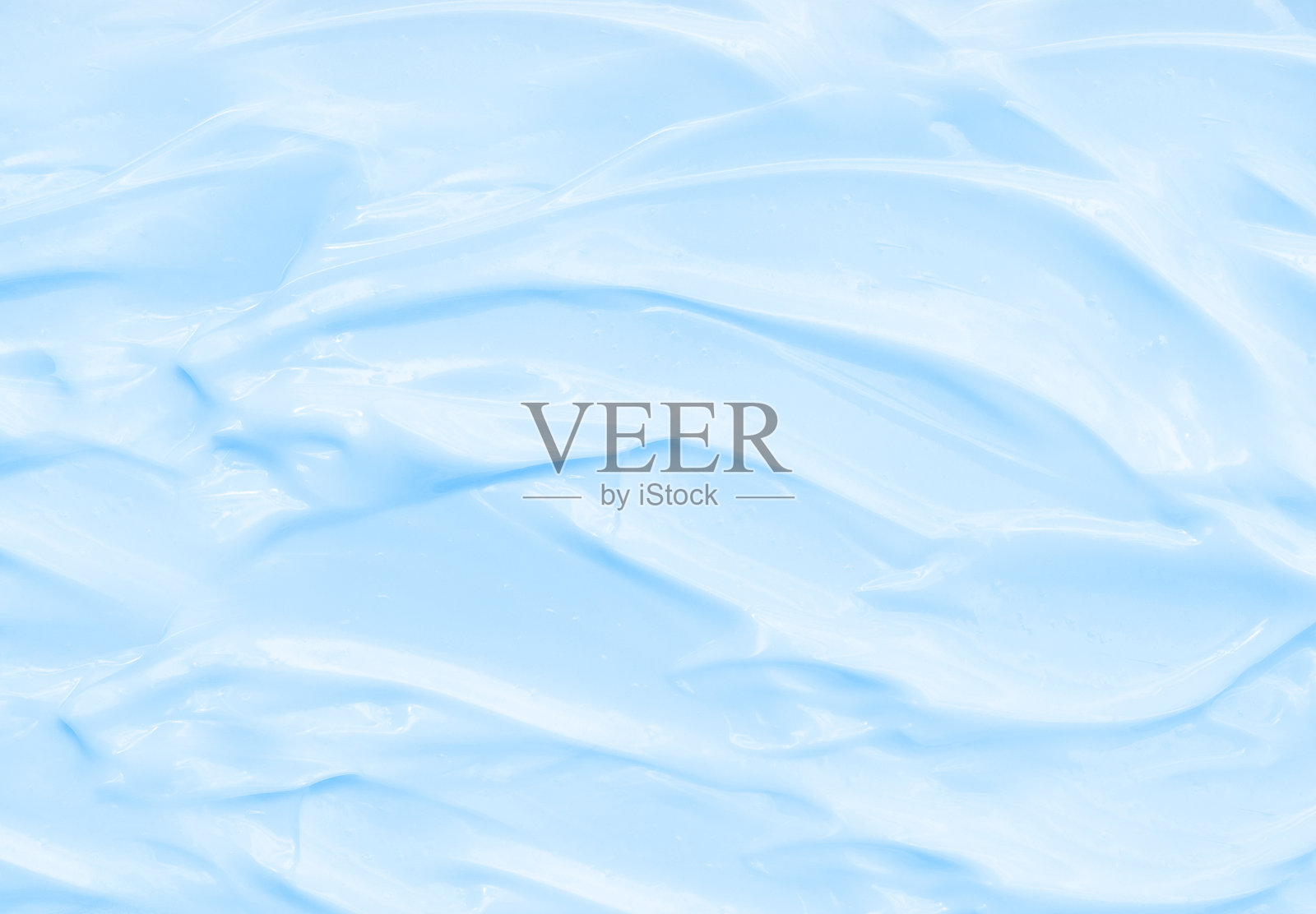 蓝色乳液护肤化妆品。美容膏质地。照片摄影图片