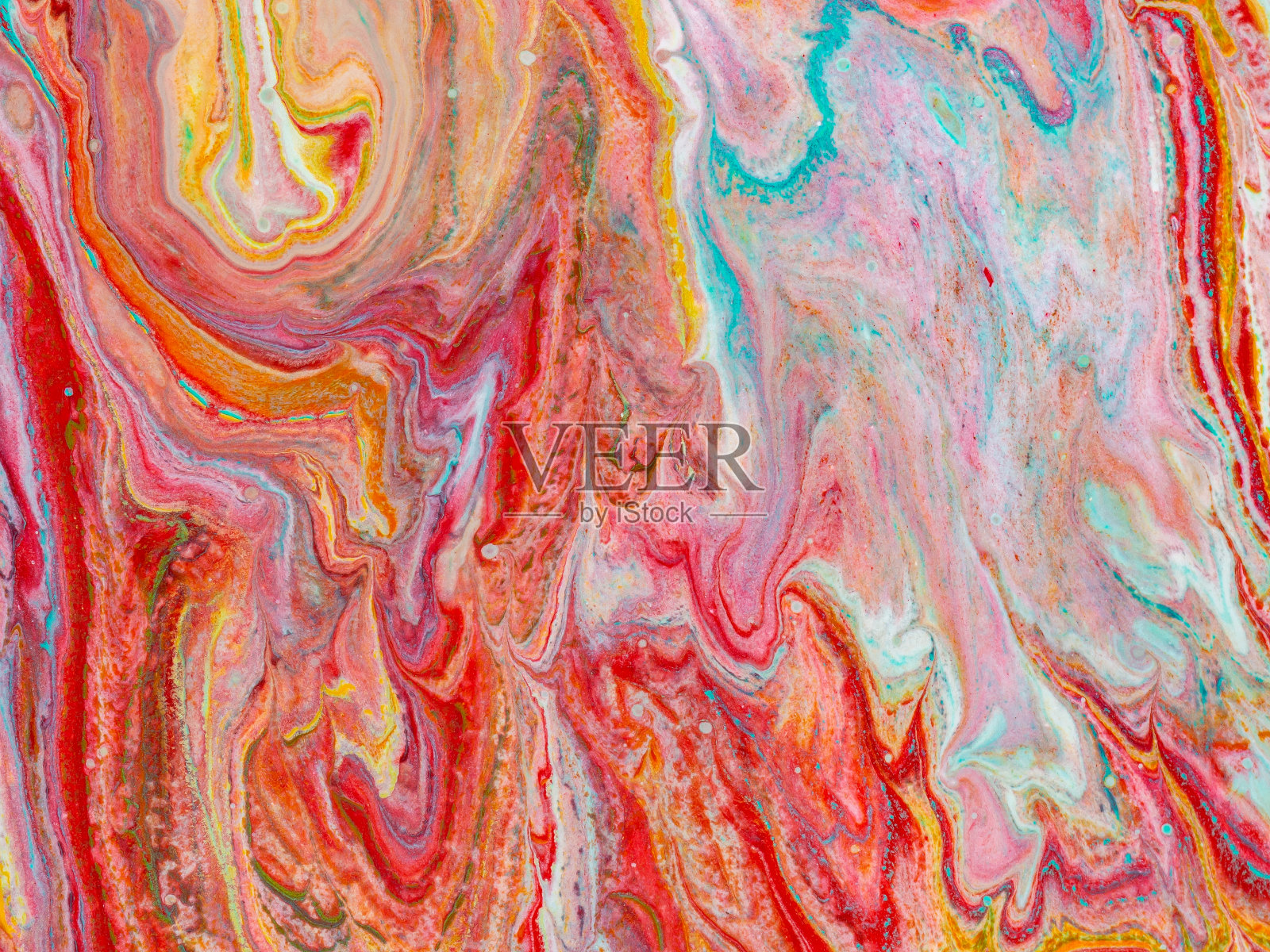 美丽的抽象背景。把丙烯酸颜料倒在画布上。照片摄影图片