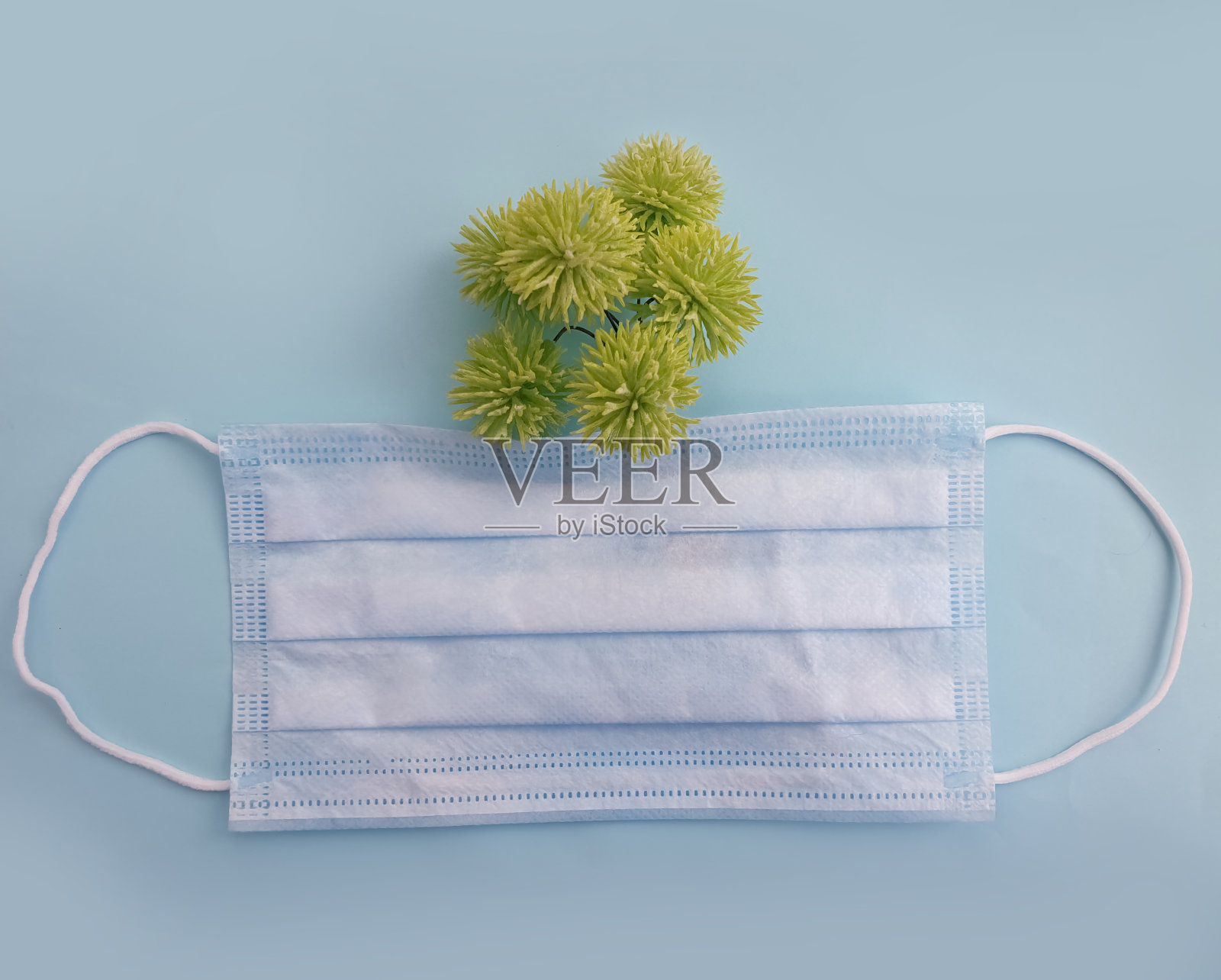 医用面具，彩色背景花照片摄影图片