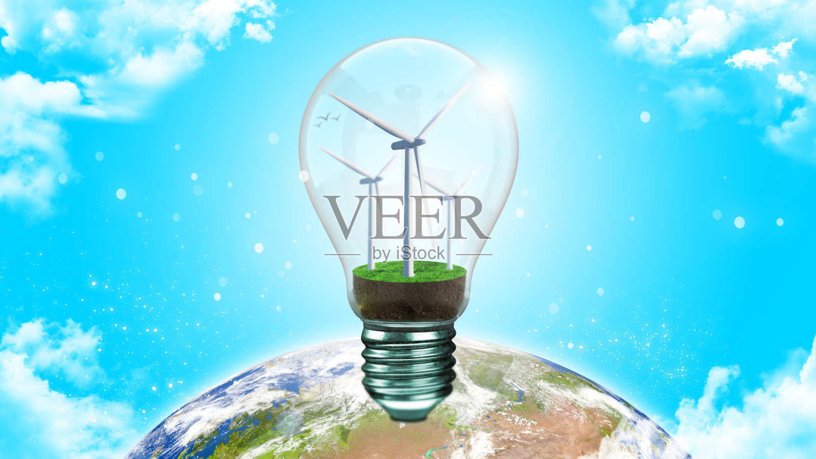 替代能源概念中的灯泡和风力涡轮机。照片摄影图片