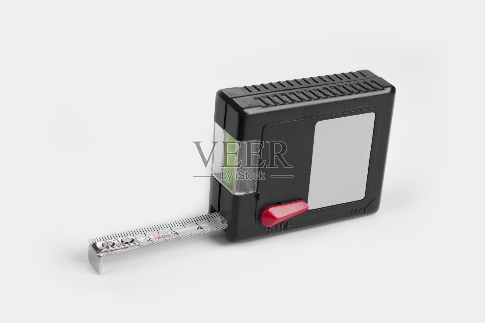 在白色背景上用卷尺测量建筑物水平照片摄影图片