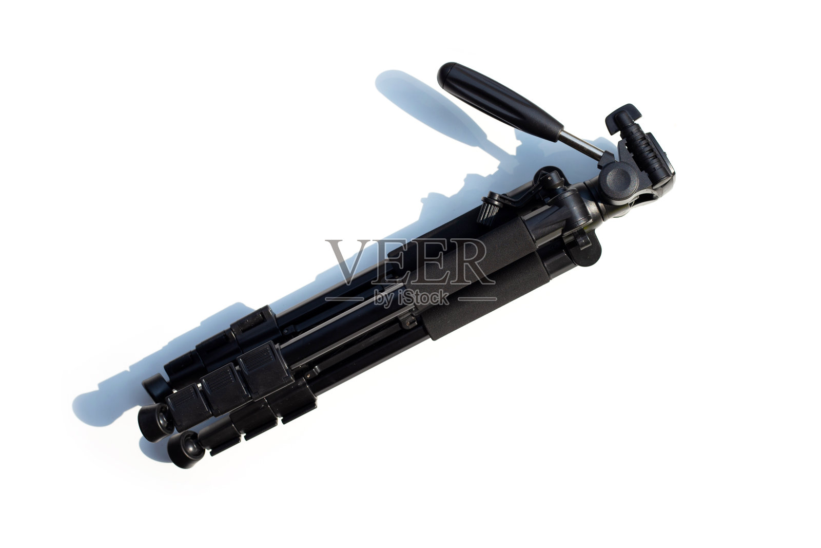 相机三脚架在白色背景上。照片摄影图片