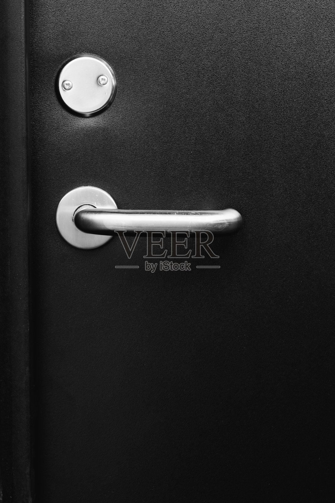 酒店房间的黑色门把手，特写镜头照片摄影图片