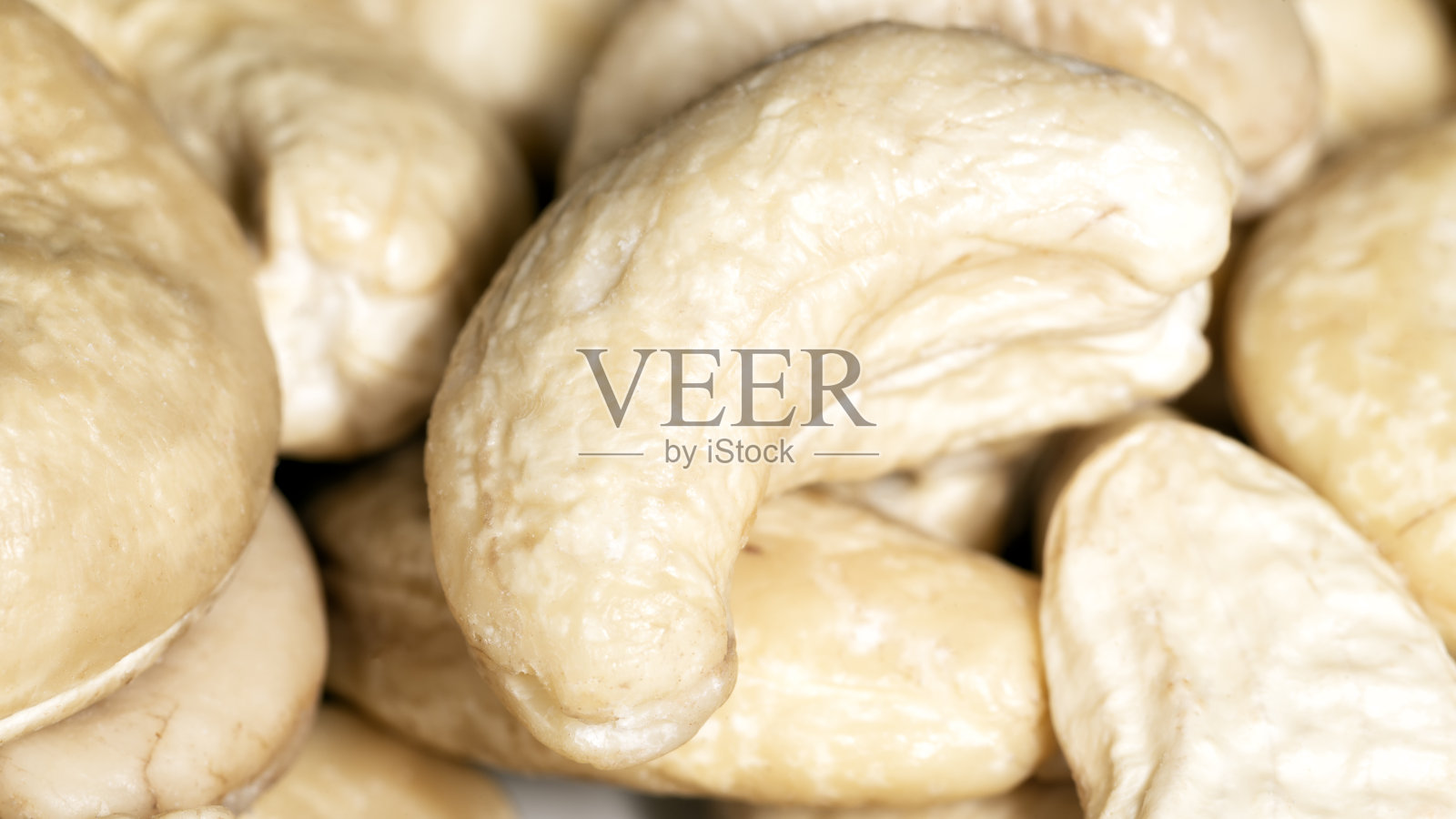 几片生腰果照片摄影图片