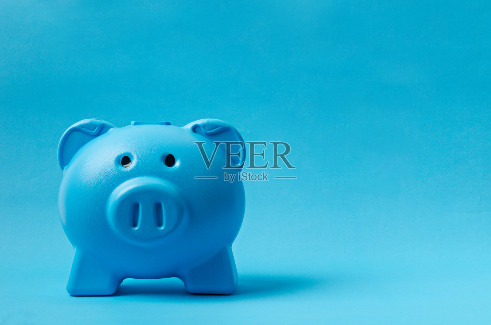 一个蓝色的存钱罐照片摄影图片