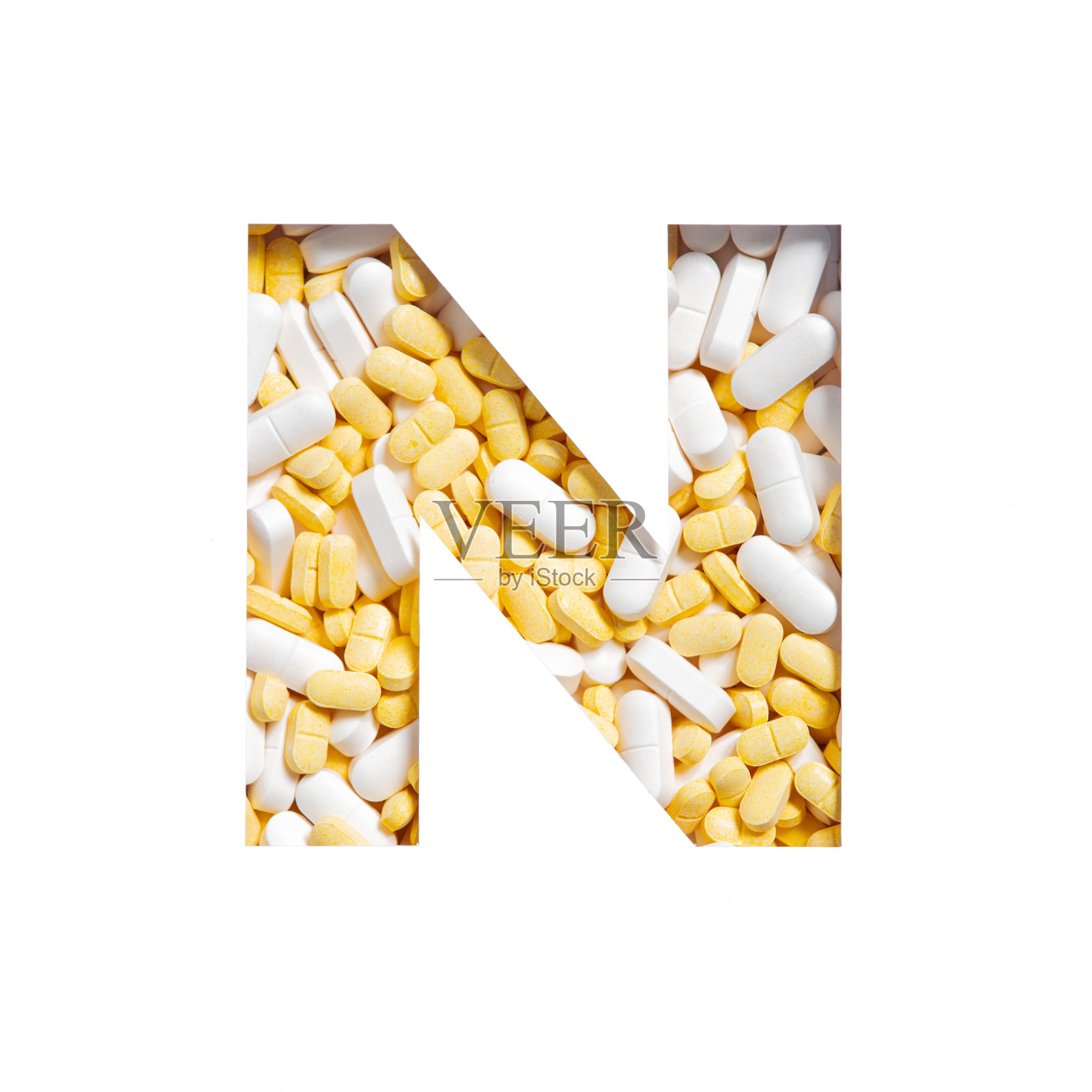 英文字母N由药片、维生素和营养补充剂组成。药店字体照片摄影图片