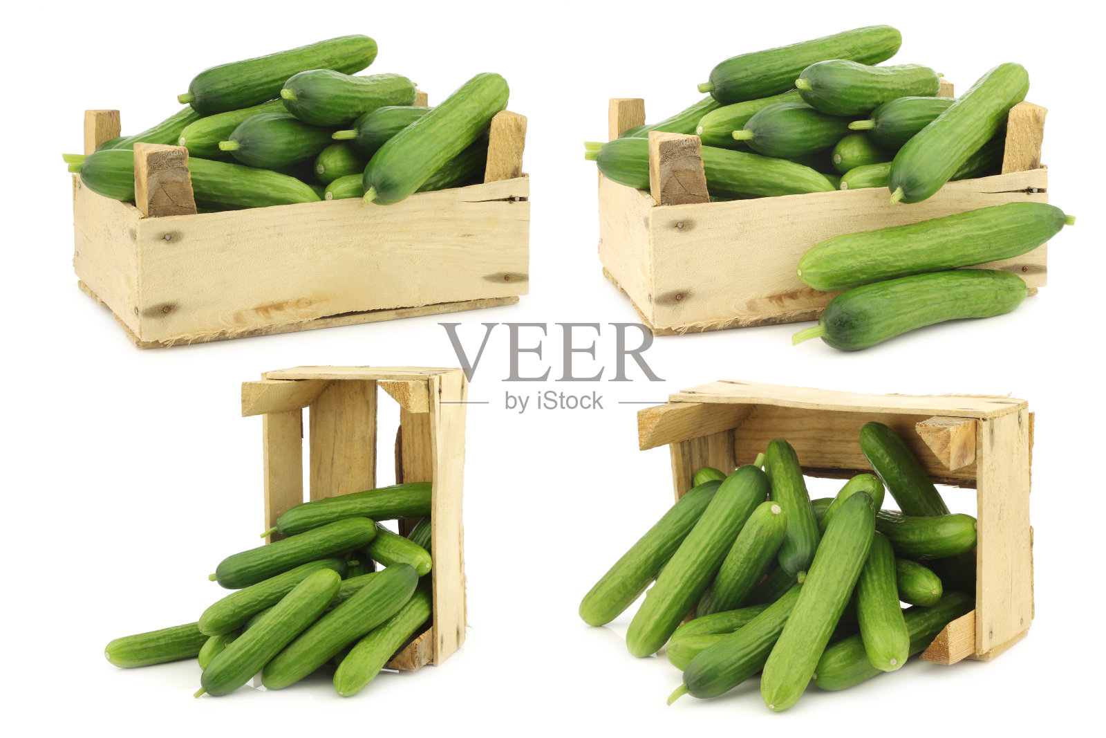 新鲜的绿色小黄瓜放在木板条箱里照片摄影图片