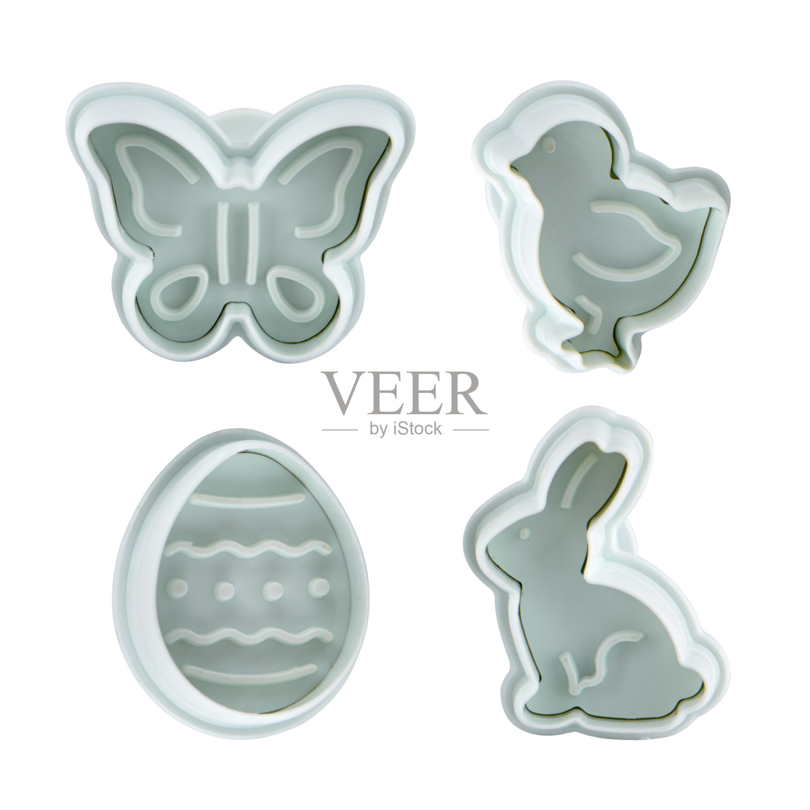 塑料切割机用于乳胶泥隔离在白色背景。模具,烤盘。俯视图，平放。复活节,春天的概念照片摄影图片