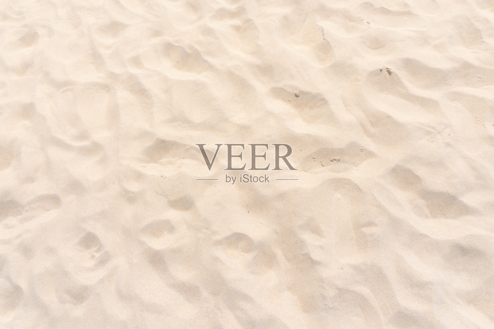 靠近沙滩上的沙子纹理照片摄影图片